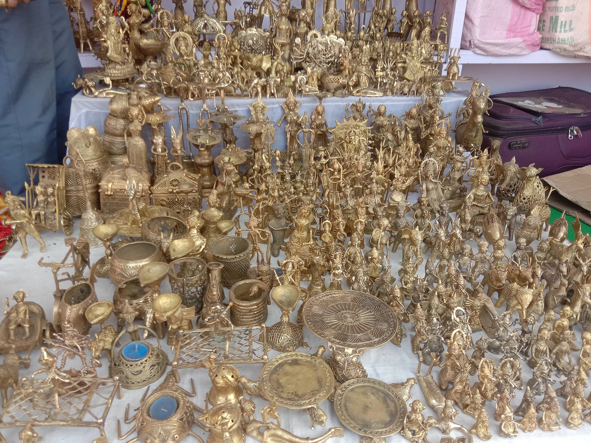 Dokra brass sculptures displayed at a West Bengal handicrafts fair